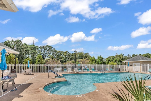 7977 Leeward Ln, Murrells Inlet, SC 29576 - community pool with a patio and view of scattered trees