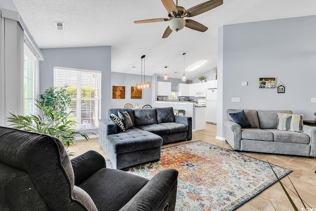 7977 Leeward Ln, Murrells Inlet, SC 29576 - living room with vaulted ceiling, ceiling fan, and light tile patterned flooring