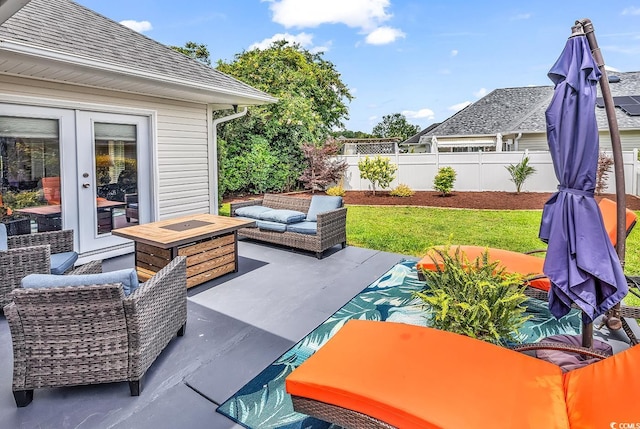 7977 Leeward Ln, Murrells Inlet, SC 29576 - view of patio with an outdoor living space with a fire pit and french doors
