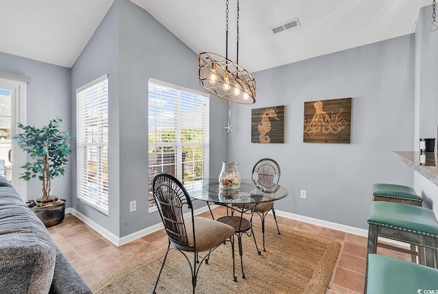 7977 Leeward Ln, Murrells Inlet, SC 29576 - dining space with vaulted ceiling and light tile patterned flooring