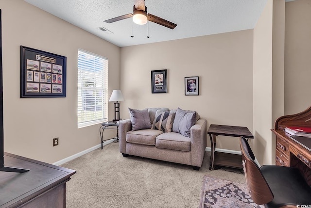 7977 Leeward Ln, Murrells Inlet, SC 29576 - living room featuring ceiling fan, carpet, and a textured ceiling