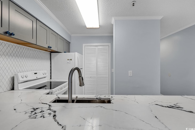 4350 Intracoastal Dr Unit 1403, Little River, SC 29566 - kitchen with white appliances, gray cabinetry, ornamental molding, light stone counters, and a textured ceiling