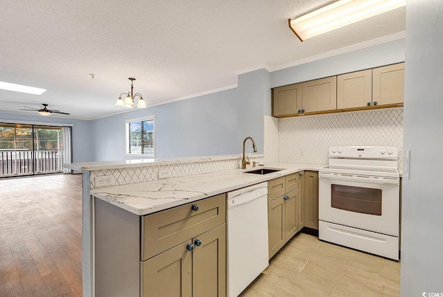 4350 Intracoastal Dr Unit 1403, Little River, SC 29566 - kitchen with white appliances, a peninsula, ornamental molding, open floor plan, and a chandelier