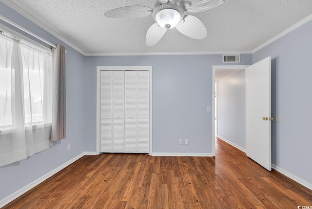 4350 Intracoastal Dr Unit 1403, Little River, SC 29566 - unfurnished bedroom featuring a textured ceiling, wood finished floors, a closet, crown molding, and a ceiling fan
