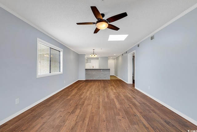 4350 Intracoastal Dr Unit 1403, Little River, SC 29566 - unfurnished living room with crown molding, a chandelier, ceiling fan, a skylight, and dark wood-type flooring