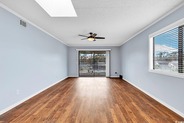 4350 Intracoastal Dr Unit 1403, Little River, SC 29566 - empty room featuring dark wood-style floors, a skylight, crown molding, a ceiling fan, and a textured ceiling