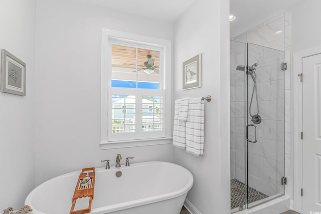 143 Enclave Pl, Pawleys Island, SC 29585 - bathroom with a soaking tub, a stall shower, and ceiling fan