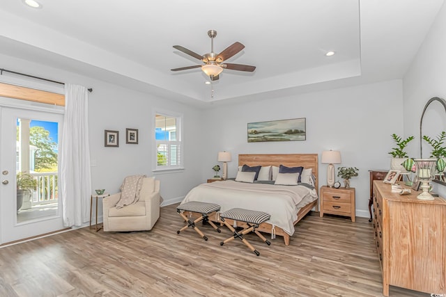 143 Enclave Pl, Pawleys Island, SC 29585 - bedroom featuring access to exterior, light wood-style floors, a raised ceiling, recessed lighting, and ceiling fan