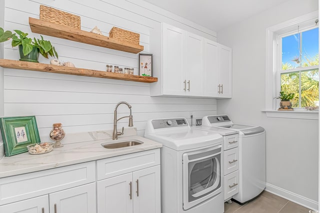 143 Enclave Pl, Pawleys Island, SC 29585 - laundry area with cabinet space, separate washer and dryer, and light tile patterned flooring
