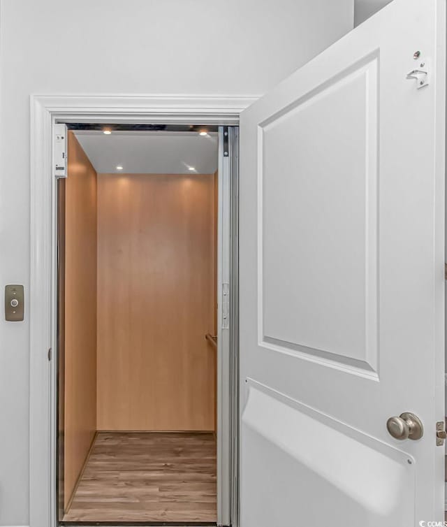 143 Enclave Pl, Pawleys Island, SC 29585 - elevator with wood finished floors