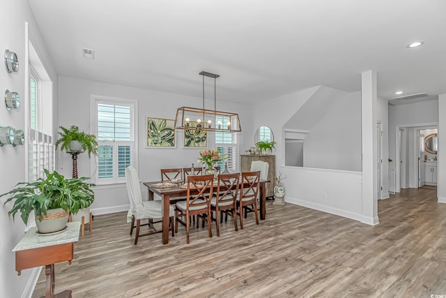 143 Enclave Pl, Pawleys Island, SC 29585 - dining space with light wood finished floors, healthy amount of natural light, recessed lighting, and a chandelier