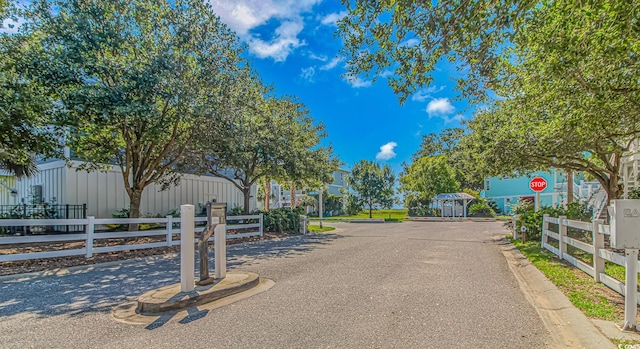 143 Enclave Pl, Pawleys Island, SC 29585 - view of asphalt street with traffic signs and curbs