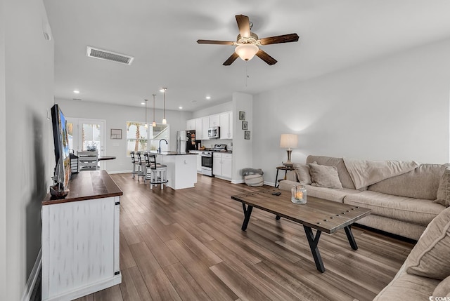1404 Bellaria Way, Myrtle Beach, SC 29579 - living room featuring ceiling fan, dark wood-type flooring, and recessed lighting