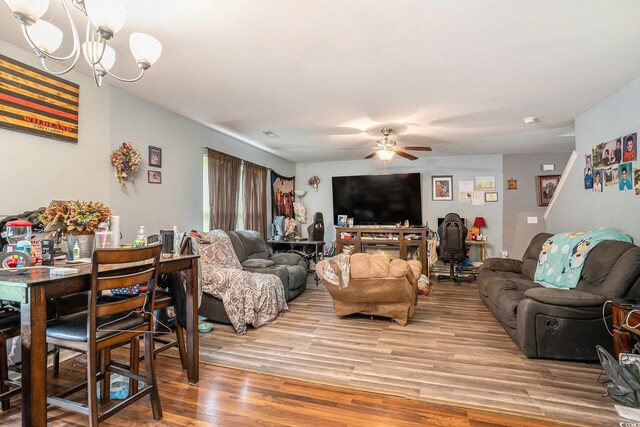 912 Clay Pigeon Ct, Longs, SC 29568 - living area with a ceiling fan, light wood-type flooring, and a chandelier