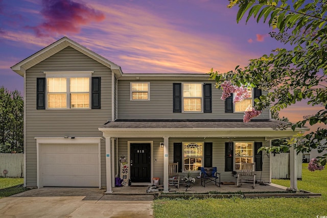 912 Clay Pigeon Ct, Longs, SC 29568 - traditional-style house with a porch, a garage, and driveway