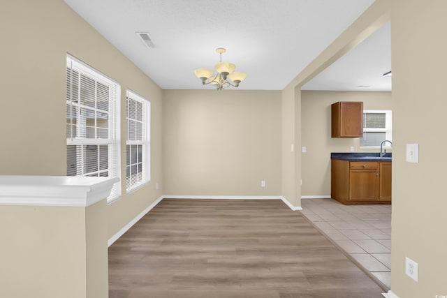 428 Bellegrove Dr, Myrtle Beach, SC 29577 - unfurnished dining area with a chandelier and light wood-style floors