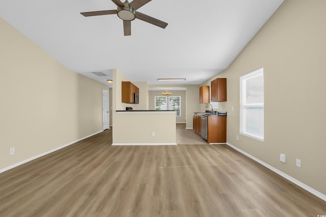 428 Bellegrove Dr, Myrtle Beach, SC 29577 - unfurnished living room featuring ceiling fan and light wood-type flooring