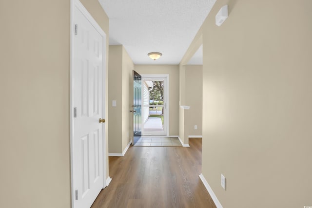 428 Bellegrove Dr, Myrtle Beach, SC 29577 - hallway featuring wood finished floors and a textured ceiling