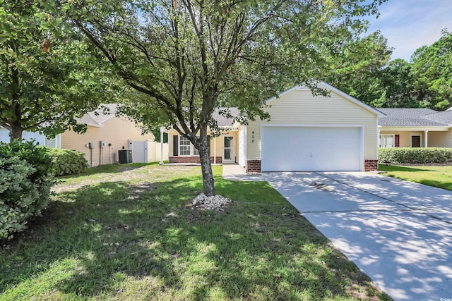 428 Bellegrove Dr, Myrtle Beach, SC 29577 - view of property hidden behind natural elements featuring an attached garage, brick siding, driveway, and a front yard