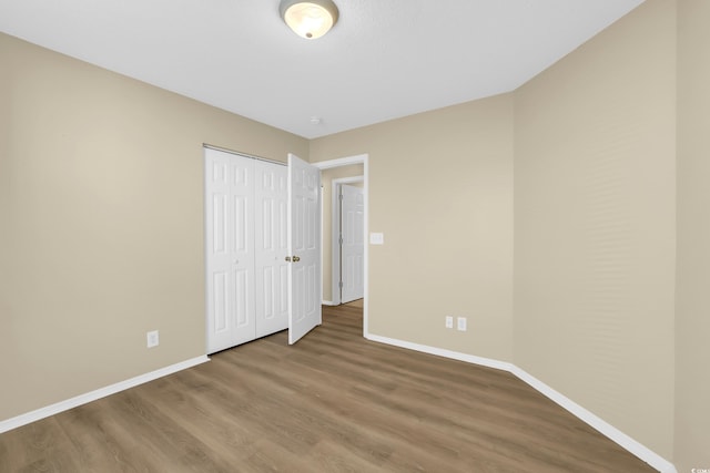 428 Bellegrove Dr, Myrtle Beach, SC 29577 - unfurnished bedroom featuring wood finished floors and a closet