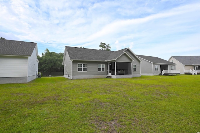 523 Charlton Blvd, Georgetown, SC 29440 - rear view of property featuring a sunroom and a lawn