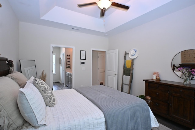 523 Charlton Blvd, Georgetown, SC 29440 - bedroom with a tray ceiling, wood finished floors, ensuite bath, and ceiling fan