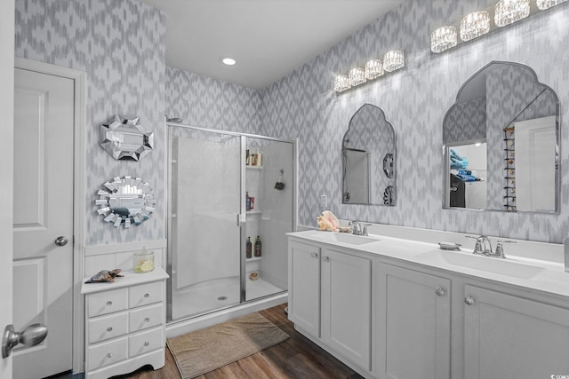 208 Forestbrook Cove Cir, Myrtle Beach, SC 29588 - full bathroom featuring wallpapered walls, a stall shower, wood finished floors, and double vanity