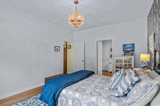208 Forestbrook Cove Cir, Myrtle Beach, SC 29588 - bedroom with a chandelier and wood finished floors
