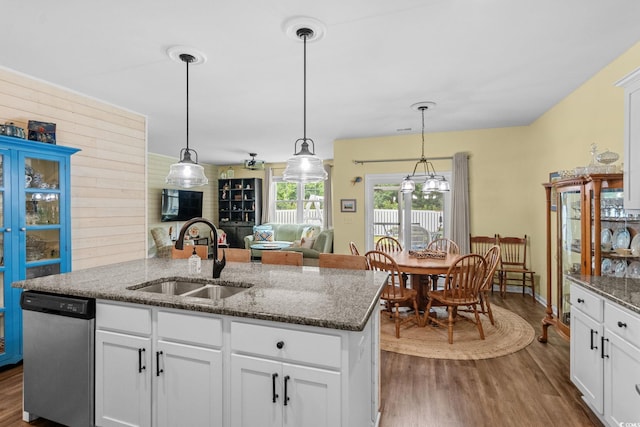 208 Forestbrook Cove Cir, Myrtle Beach, SC 29588 - kitchen with dishwasher, dark wood finished floors, a kitchen island with sink, dark stone counters, and white cabinetry