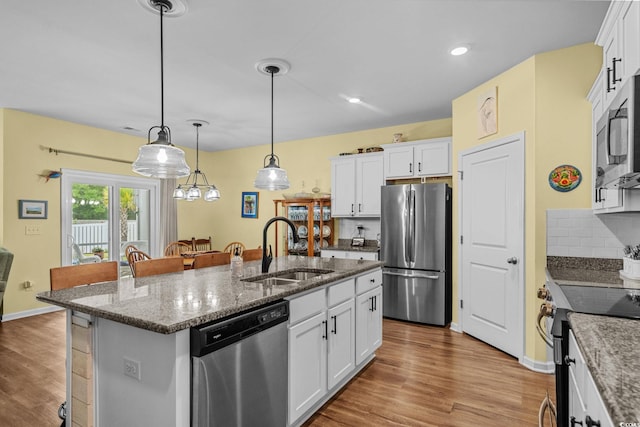 208 Forestbrook Cove Cir, Myrtle Beach, SC 29588 - kitchen featuring appliances with stainless steel finishes, wood finished floors, white cabinets, and recessed lighting