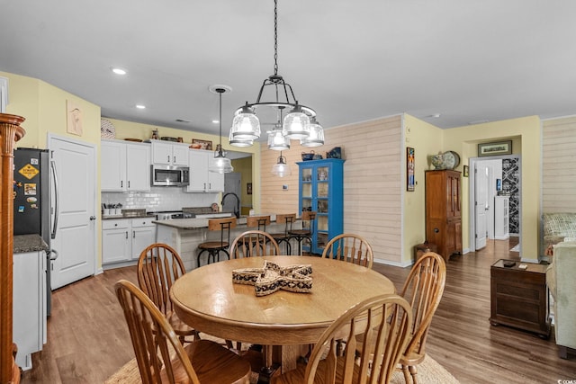 208 Forestbrook Cove Cir, Myrtle Beach, SC 29588 - dining space featuring wood finished floors, a chandelier, and recessed lighting