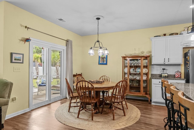 208 Forestbrook Cove Cir, Myrtle Beach, SC 29588 - dining room with dark wood-style floors and a chandelier