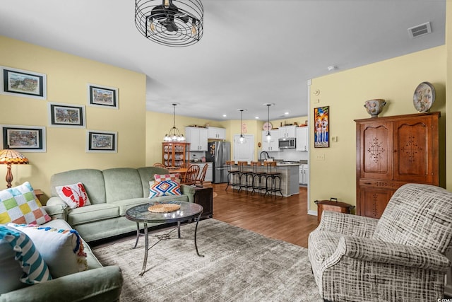 208 Forestbrook Cove Cir, Myrtle Beach, SC 29588 - living room featuring wood finished floors, recessed lighting, a chandelier, and ceiling fan