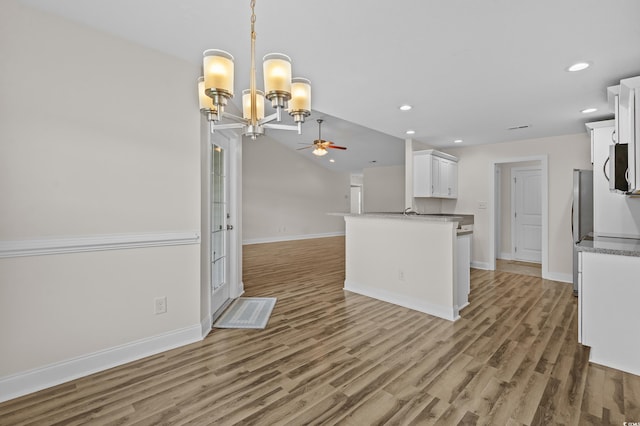 104 Fox Trot Dr, Galivants Ferry, SC 29544 - kitchen with stainless steel appliances, white cabinetry, open floor plan, ceiling fan, and light wood finished floors