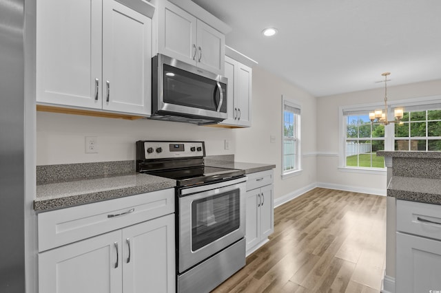 104 Fox Trot Dr, Galivants Ferry, SC 29544 - kitchen featuring appliances with stainless steel finishes, a chandelier, white cabinetry, healthy amount of natural light, and recessed lighting