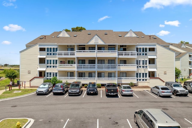 1100 Possum Trot Rd Unit G117, North Myrtle Beach, SC 29582 - view of building exterior with uncovered parking