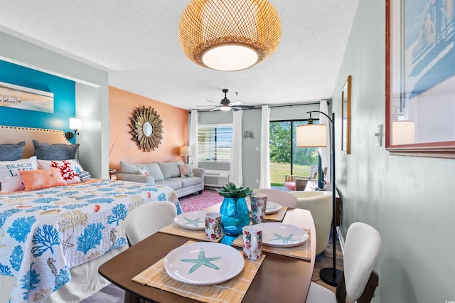 1100 Possum Trot Rd Unit G117, North Myrtle Beach, SC 29582 - bedroom with a textured ceiling, ceiling fan, and wood finished floors