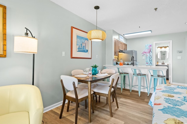1100 Possum Trot Rd Unit G117, North Myrtle Beach, SC 29582 - dining area with light wood-style floors and baseboards