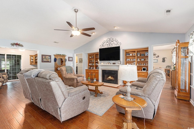 906 Hope Cir, Conway, SC 29527 - living room featuring ceiling fan, a fireplace with flush hearth, hardwood / wood-style flooring, and high vaulted ceiling