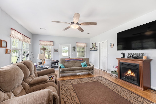 906 Hope Cir, Conway, SC 29527 - living area with healthy amount of natural light, ceiling fan, light wood-type flooring, and a glass covered fireplace