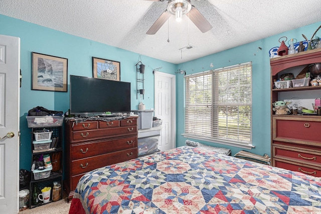 906 Hope Cir, Conway, SC 29527 - carpeted bedroom with a textured ceiling and a ceiling fan