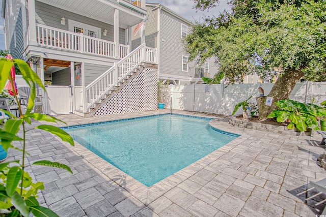 115A 8th Ave N, Surfside Beach, SC 29575 - view of pool featuring a fenced backyard, stairway, and a patio