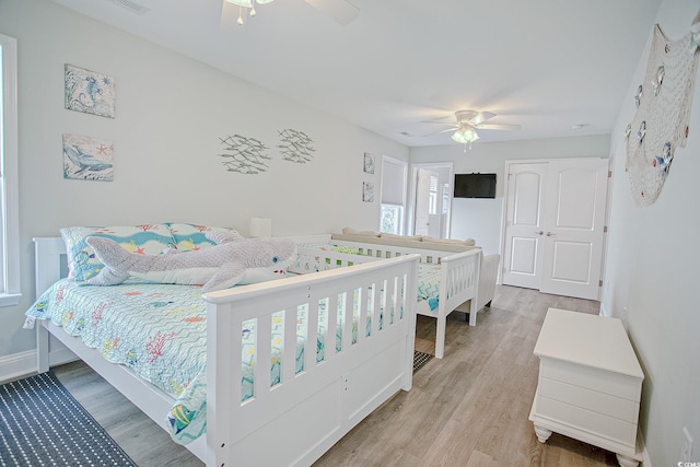 115A 8th Ave N, Surfside Beach, SC 29575 - bedroom with light wood finished floors and a ceiling fan