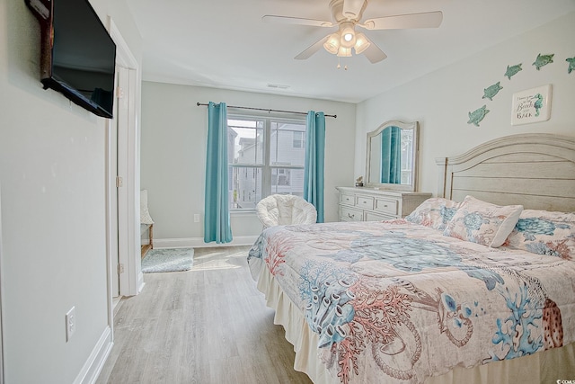115A 8th Ave N, Surfside Beach, SC 29575 - bedroom featuring light wood finished floors and a ceiling fan