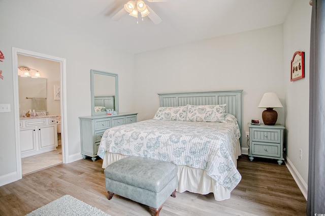 115A 8th Ave N, Surfside Beach, SC 29575 - bedroom featuring wood finished floors, ensuite bath, and a ceiling fan