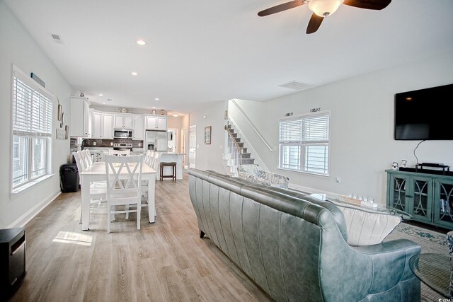 115A 8th Ave N, Surfside Beach, SC 29575 - living area featuring ceiling fan, light wood finished floors, stairway, and recessed lighting