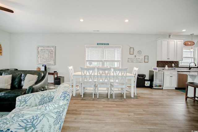 115A 8th Ave N, Surfside Beach, SC 29575 - living room featuring light wood-style flooring, beverage cooler, recessed lighting, and a ceiling fan