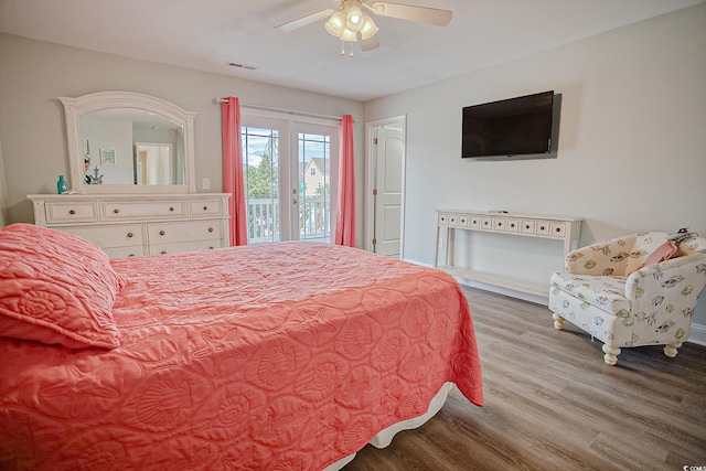 115A 8th Ave N, Surfside Beach, SC 29575 - bedroom featuring wood finished floors, access to exterior, and a ceiling fan