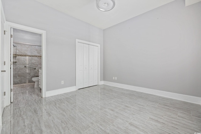 257 Venice Way Unit 2201, Myrtle Beach, SC 29577 - unfurnished bedroom featuring a closet and connected bathroom