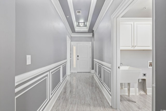 257 Venice Way Unit 2201, Myrtle Beach, SC 29577 - corridor featuring ornamental molding, a decorative wall, light wood finished floors, and wainscoting